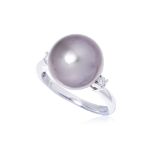 A CULTURED TAHITIAN PEARL AND DIAMOND RING