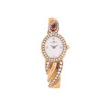 A BAUME & MERCIER LADIES GOLD AND DIAMOND BANGLE WATCH