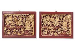 A PAIR OF CARVED AND GILT WOOD PANELS