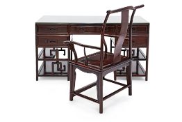 A CHINESE HARDWOOD TWIN PEDESTAL DESK AND ARMCHAIR