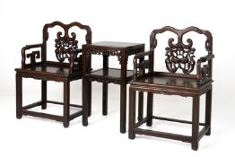 A PAIR OF BLACKWOOD ARMCHAIRS AND TABLE