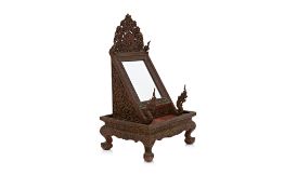 A THAI CARVED AND LACQUERED MIRROR STAND