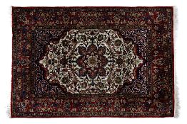 A SMALL MIDDLE EASTERN SILK RUG