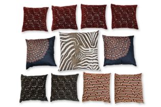 A GROUP OF MADURA AND OTHER ASSORTED THROW CUSHIONS