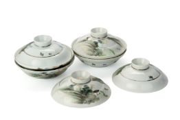 A SET OF FOUR PORCELAIN BOWLS AND COVERS