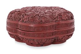 A CARVED CINNABAR LACQUER PRUNUS BOX AND COVER
