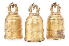 A SET OF THREE BURMESE OR THAI GILT BRONZE BELLS