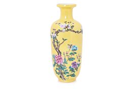 A YELLOW GROUND FAMILLE ROSE PORCELAIN VASE