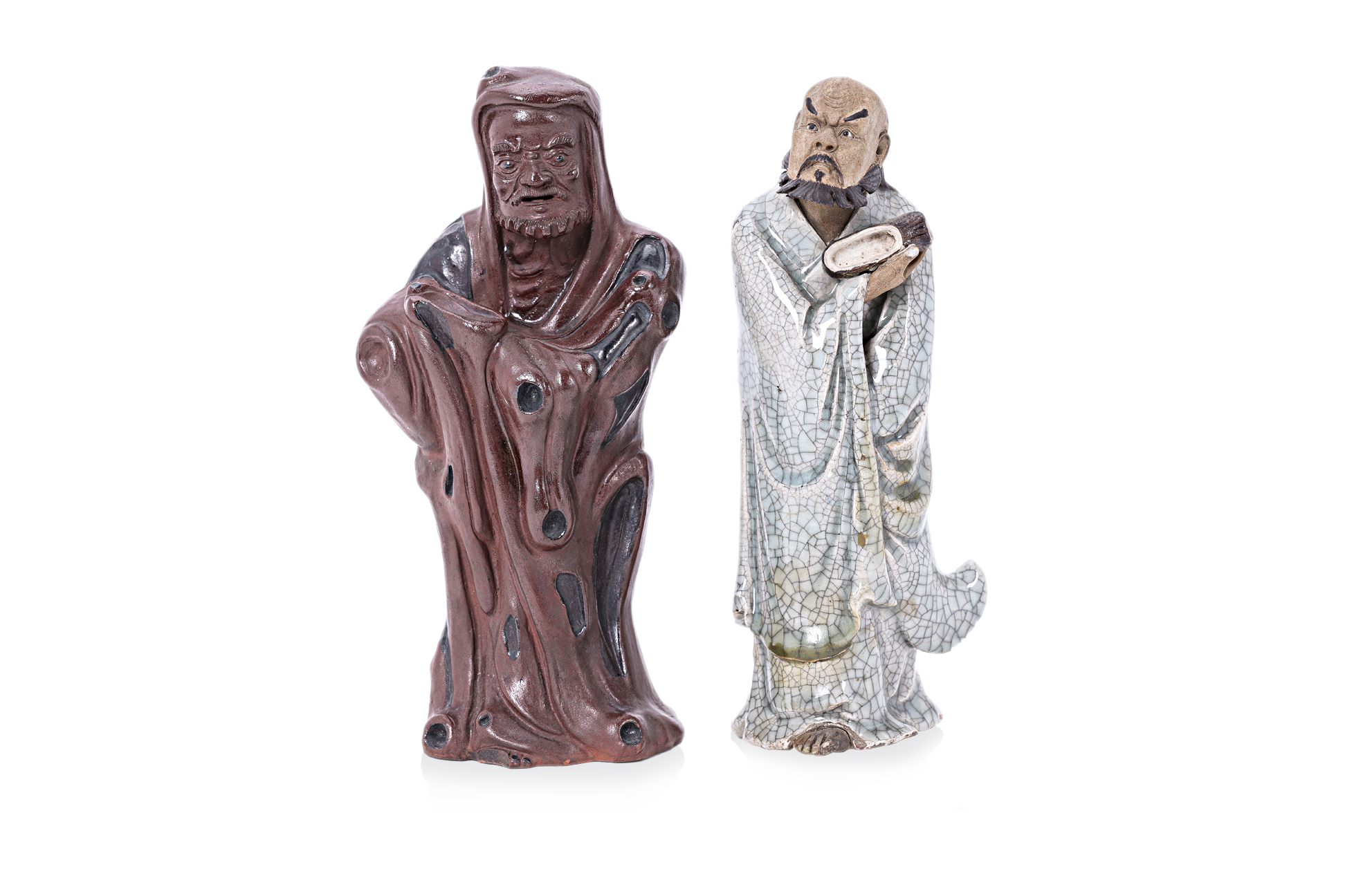 TWO GLAZED POTTERY FIGURES OF DAMO