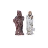 TWO GLAZED POTTERY FIGURES OF DAMO