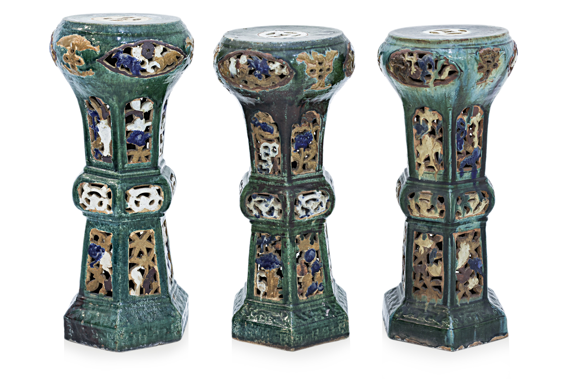 A GROUP OF THREE GLAZED POTTERY JARDINERE STANDS