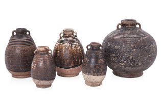 A GROUP OF FIVE THAI BOTTLES