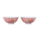 A PAIR OF IRON RED AND GILT PHOENIX PORCELAIN BOWLS