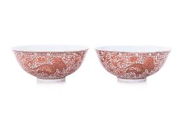 A PAIR OF IRON RED AND GILT PHOENIX PORCELAIN BOWLS