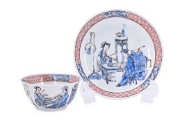 A BLUE AND PINK ENAMELLED PORCELAIN TEA BOWL AND SAUCER