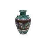 A LARGE GLAZED POTTERY DRAGON STORAGE JAR