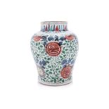 A WUCAI PORCELAIN SCROLLING PEONY JAR