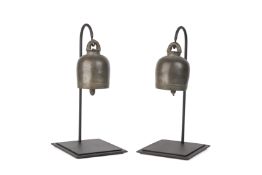 A PAIR OF SOUTHEAST-ASIAN BRONZE TEMPLE BELLS ON STANDS