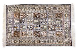 A SMALL SILK PANELLED RUG