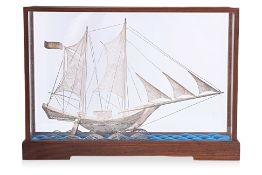 A SILVER FILIGREE MODEL OF A SHIP IN DISPLAY BOX
