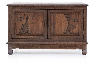 A CARVED TEAK LOW CABINET