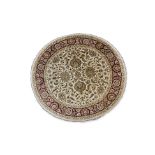 AN INDIAN AGRA CIRCULAR WOOL RUG