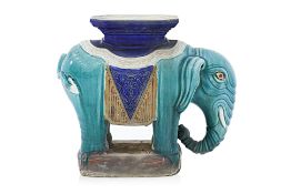 A CERAMIC ELEPHANT PLANT STAND