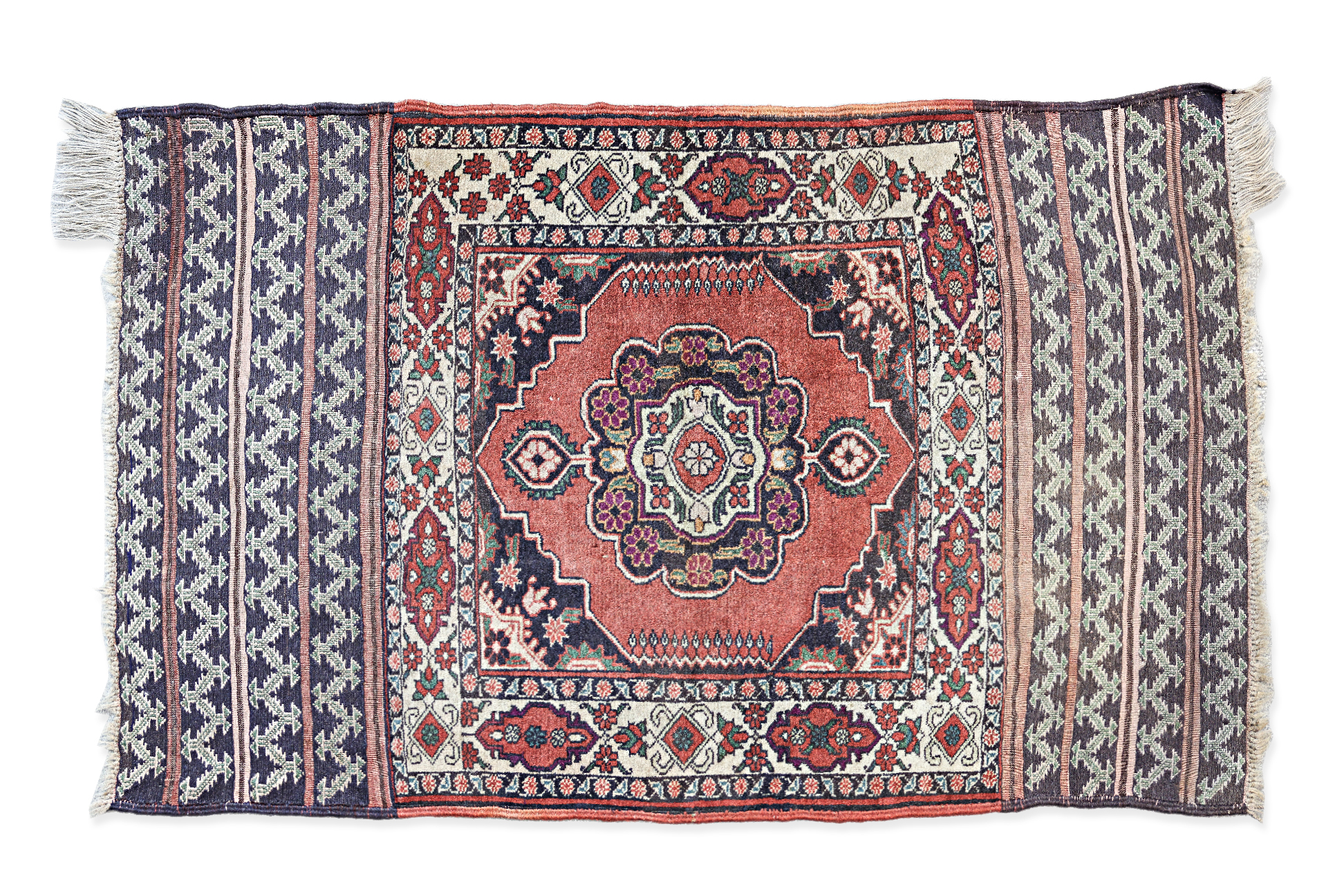 A SMALL MIDDLE EASTERN WOOL RUG