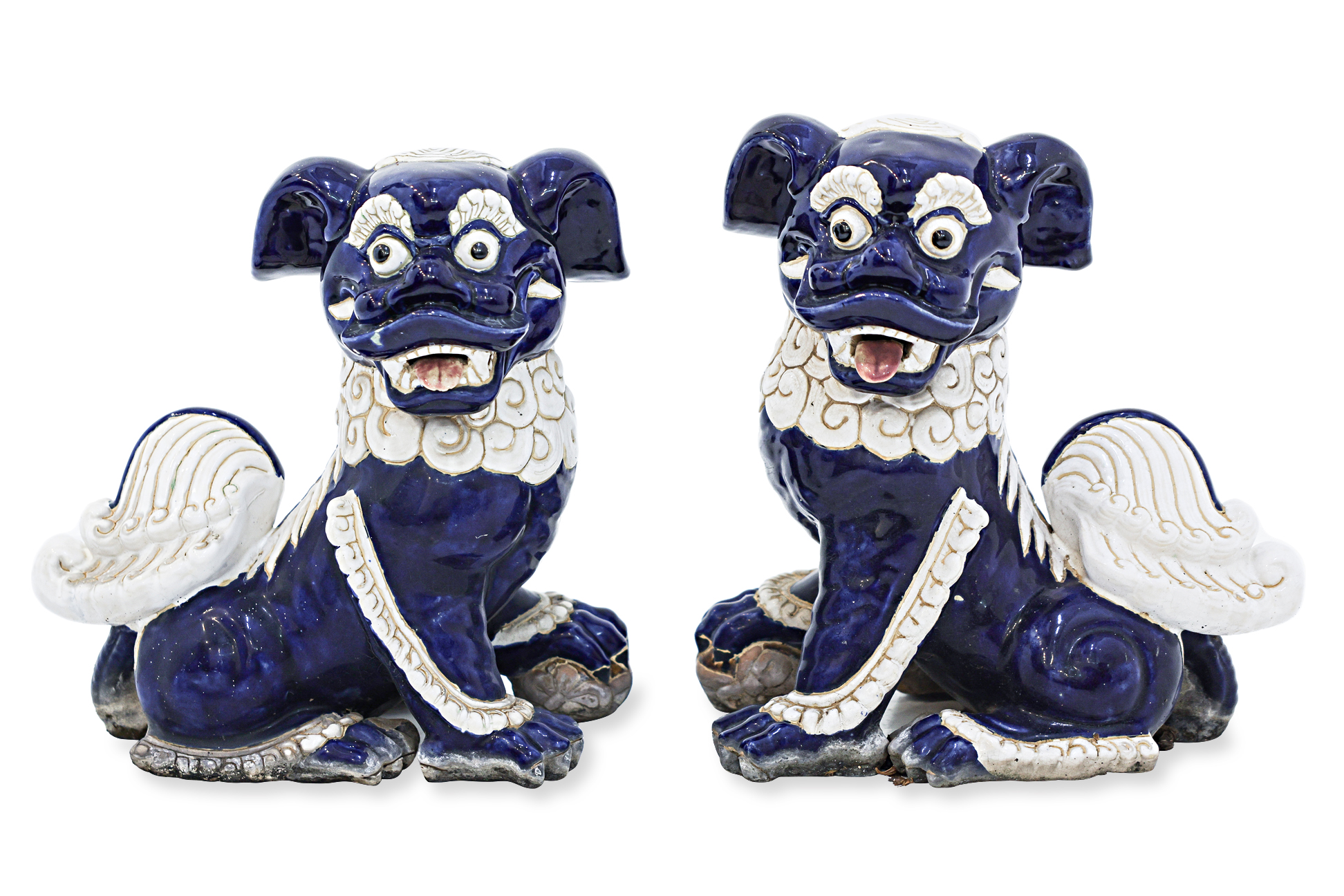 A PAIR OF CERAMIC FOO DOGS