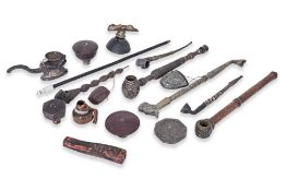 A GROUP OF VARIOUS SMOKING PIPES AND RELATED IMPLEMENTS