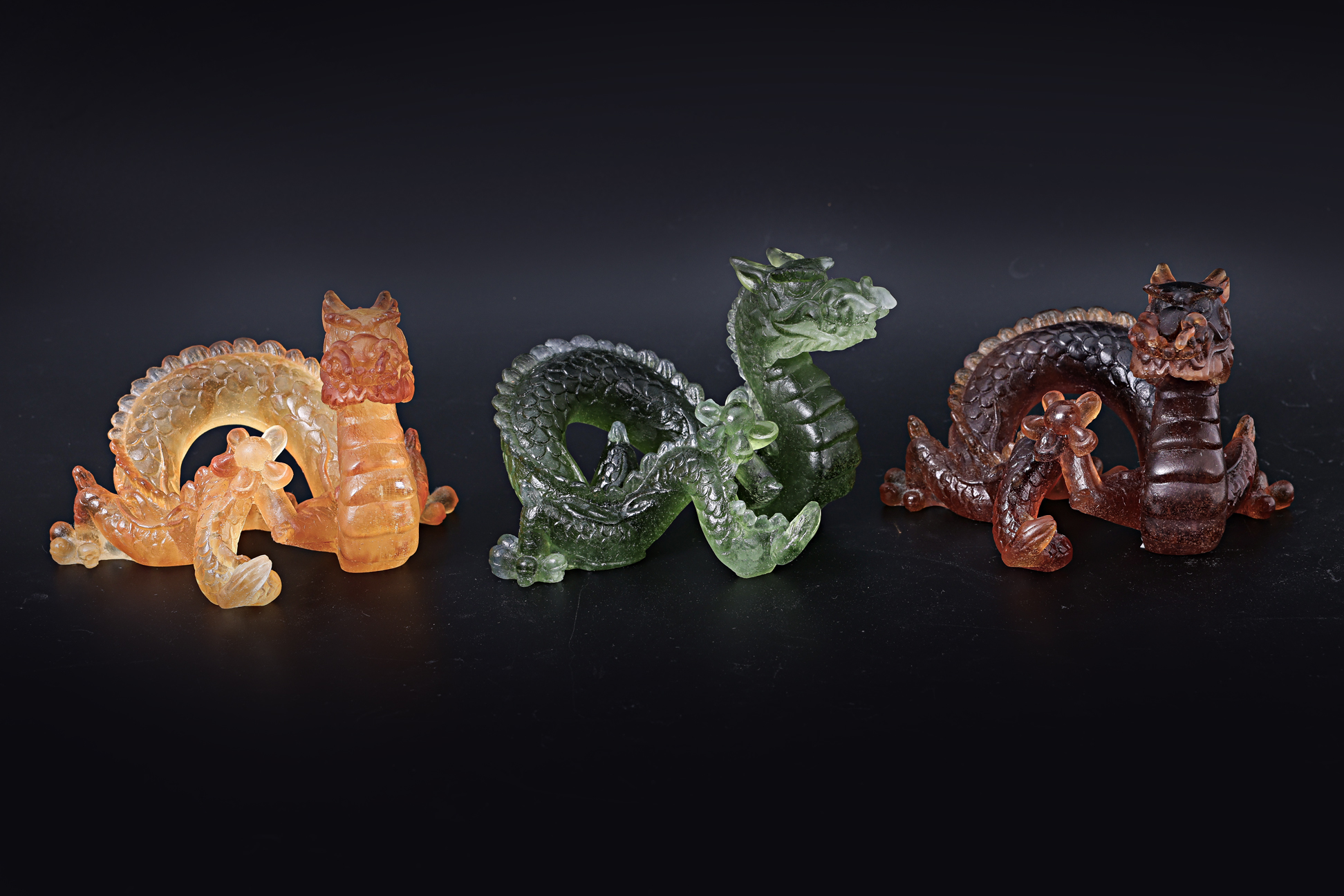 A GROUP OF THREE DAUM GLASS DRAGONS