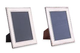 A PAIR OF ENGLISH SILVER PHOTOGRAPH FRAMES