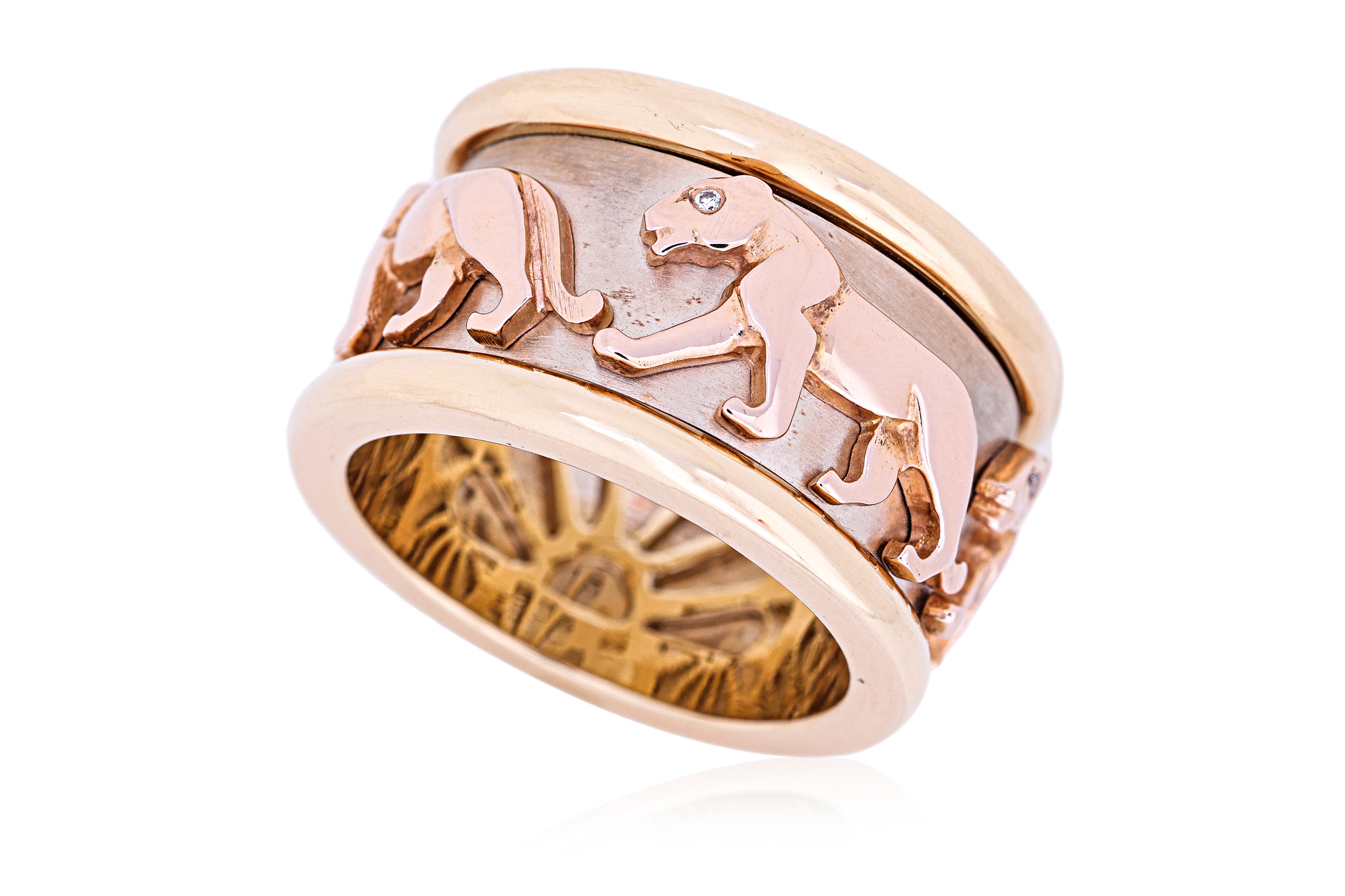 A TRI COLOUR GOLD 'ROTATING PANTHER' RING