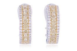 A PAIR OF YELLOW AND WHITE DIAMOND HOOP EARRINGS