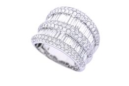 A LARGE BAGUETTE AND ROUND DIAMOND RING