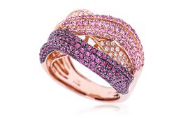 A RUBY, PINK SAPPHIRE AND DIAMOND CROSSOVER RING