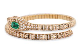 AN EMERALD AND DIAMOND 'SERPENT' BANGLE