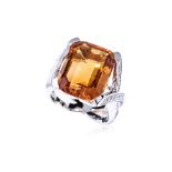 A LARGE CITRINE AND DIAMOND RING