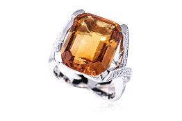 A LARGE CITRINE AND DIAMOND RING