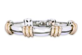 AN 'ATLAS' SILVER AND GOLD BRACELET BY TIFFANY & CO.
