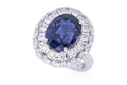 A LARGE UNHEATED COLOUR CHANGE SAPPHIRE AND DIAMOND RING