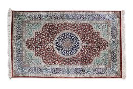 A PERSIAN STYLE MEDALLION SILK RUG