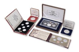 SINGAPORE - A GROUP OF FIVE PROOF AND UNC COIN SETS