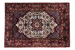 A SMALL MIDDLE EASTERN SILK RUG