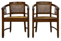 A PAIR OF TEAK AND RATTAN ARMCHAIRS