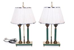 A PAIR OF GILT BRASS AND LEATHER COVERED TABLE LAMPS