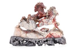 A CHINESE DECORATIVE STONE CARVING OF HORSES