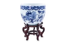 A BLUE AND WHITE JARDINIÈRE AND STAND