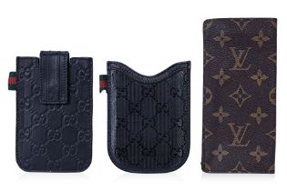 AN ASSORTMENT OF GUCCI AND OTHER DESIGNER LEATHER CASES