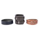 A GROUP OF THREE HERMES LEATHER BRACELETS